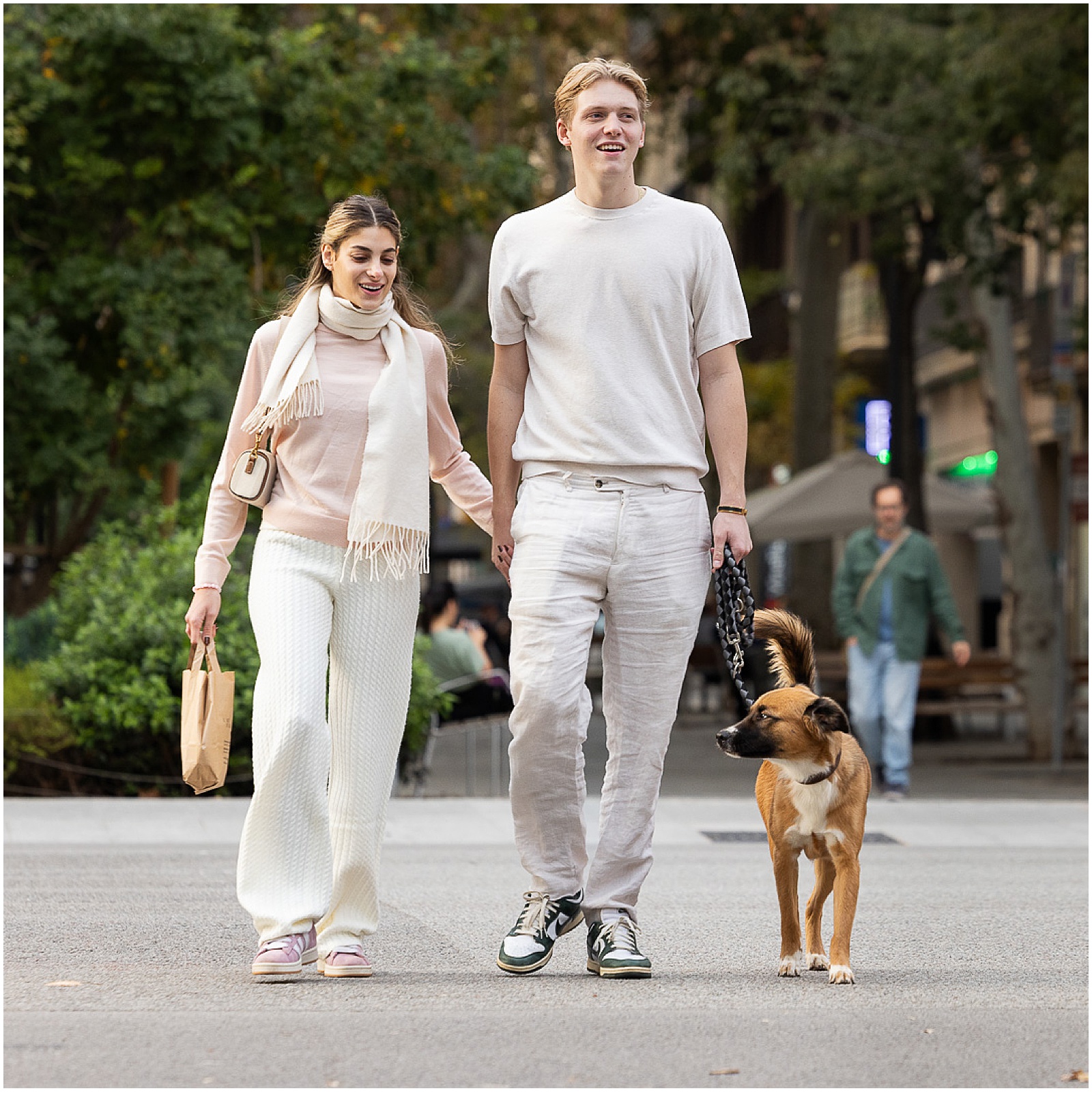 Couple walking their dog in Barcelona taken by dog photographer Jill Brammer